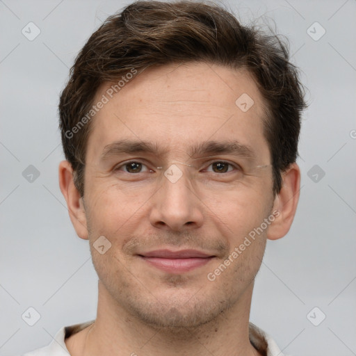 Joyful white adult male with short  brown hair and brown eyes