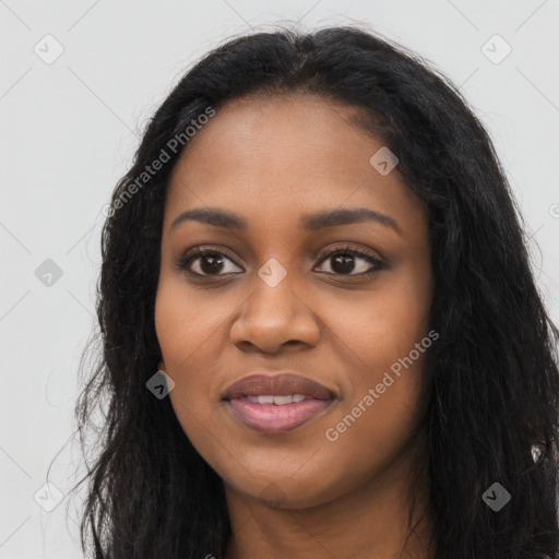 Joyful black young-adult female with long  black hair and brown eyes