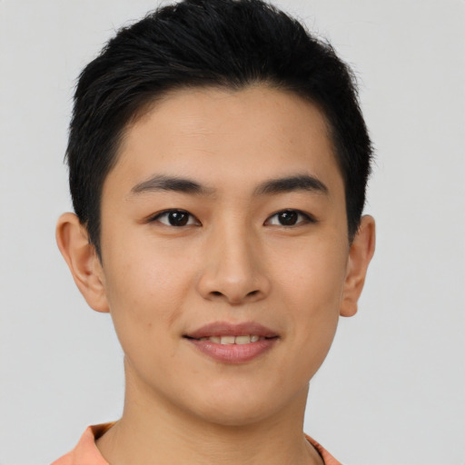 Joyful asian young-adult male with short  brown hair and brown eyes