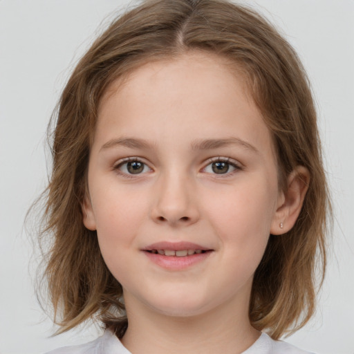 Joyful white child female with medium  brown hair and brown eyes