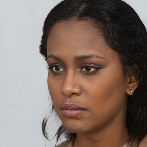 Neutral black young-adult female with long  black hair and brown eyes