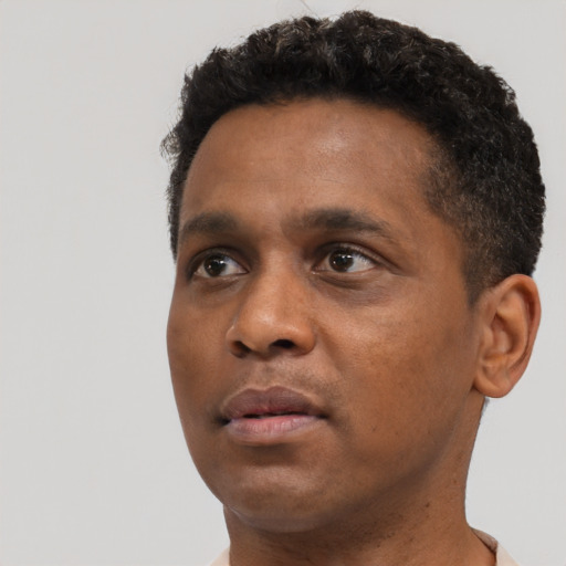 Neutral black young-adult male with short  black hair and brown eyes