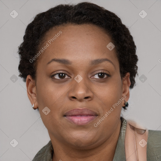 Joyful black adult female with short  brown hair and brown eyes