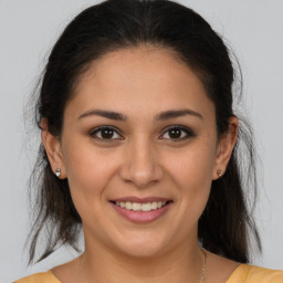 Joyful white young-adult female with medium  brown hair and brown eyes