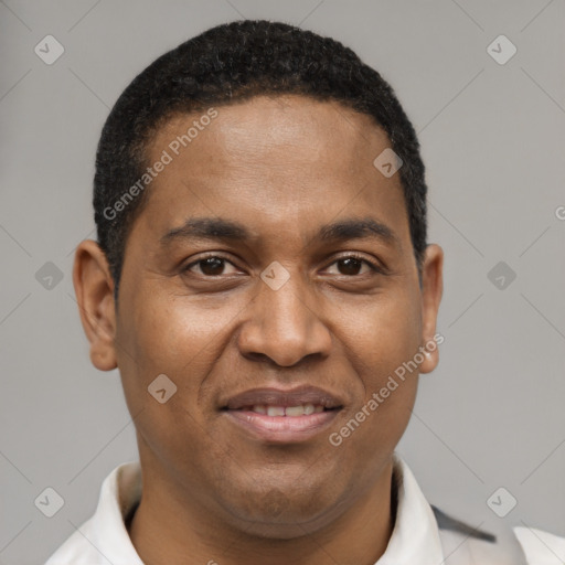 Joyful latino young-adult male with short  brown hair and brown eyes