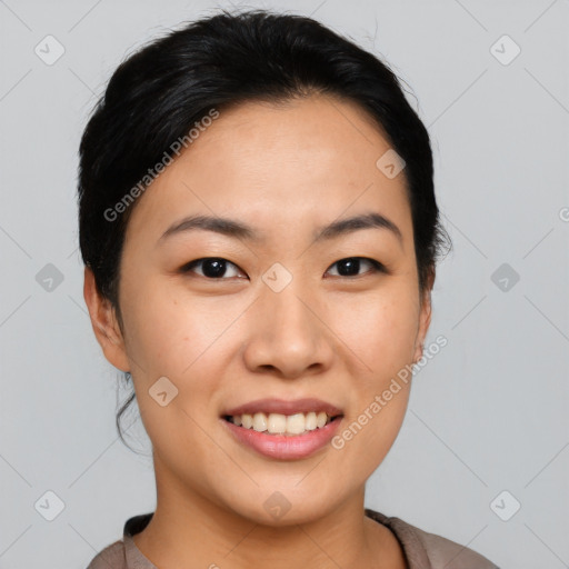 Joyful asian young-adult female with short  black hair and brown eyes