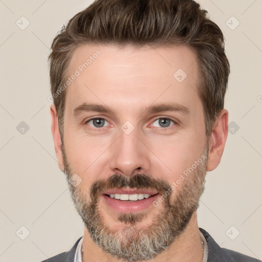 Joyful white adult male with short  brown hair and brown eyes