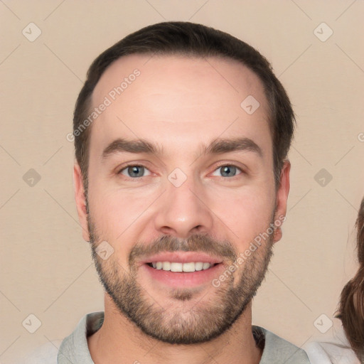 Joyful white young-adult male with short  brown hair and brown eyes