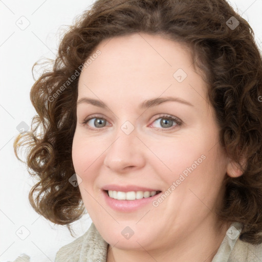 Joyful white young-adult female with medium  brown hair and green eyes