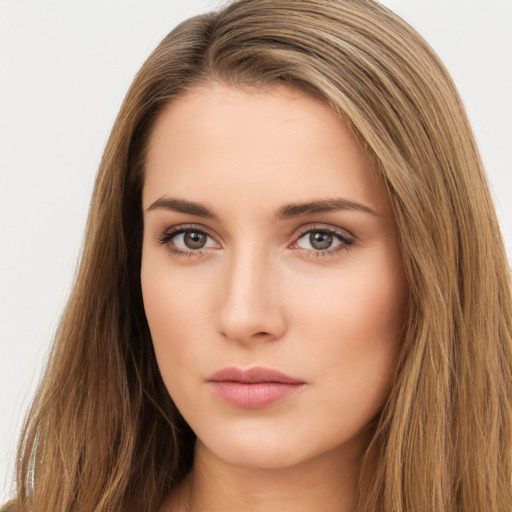 Neutral white young-adult female with long  brown hair and brown eyes