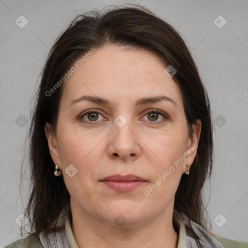 Joyful white adult female with medium  brown hair and brown eyes