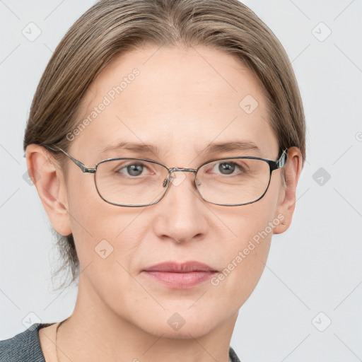 Joyful white adult female with short  brown hair and grey eyes