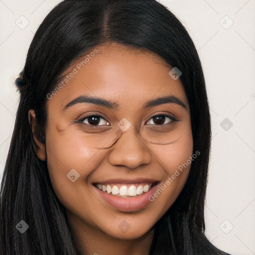 Joyful latino young-adult female with long  brown hair and brown eyes