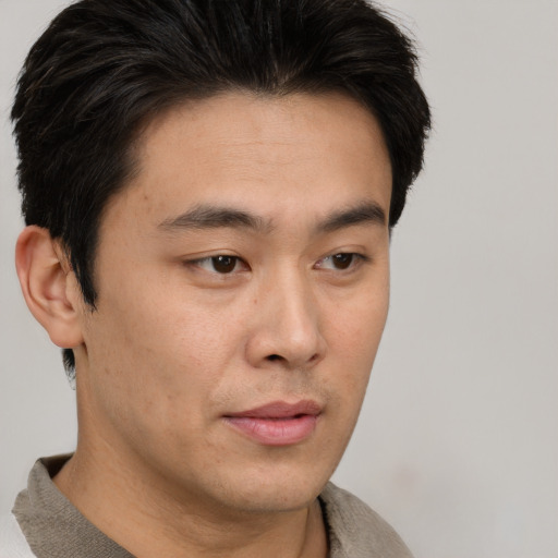 Neutral asian young-adult male with short  brown hair and brown eyes