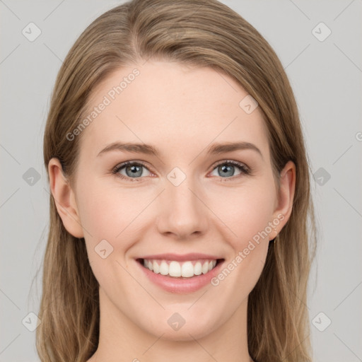 Joyful white young-adult female with long  brown hair and green eyes