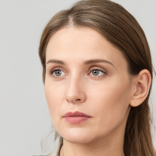 Neutral white young-adult female with long  brown hair and grey eyes