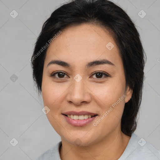 Joyful asian young-adult female with medium  brown hair and brown eyes