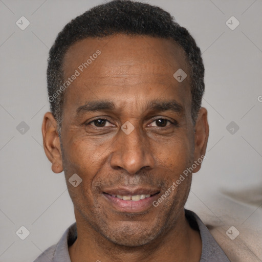 Joyful black adult male with short  black hair and brown eyes