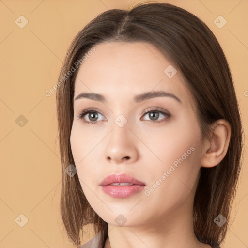 Neutral white young-adult female with long  brown hair and brown eyes