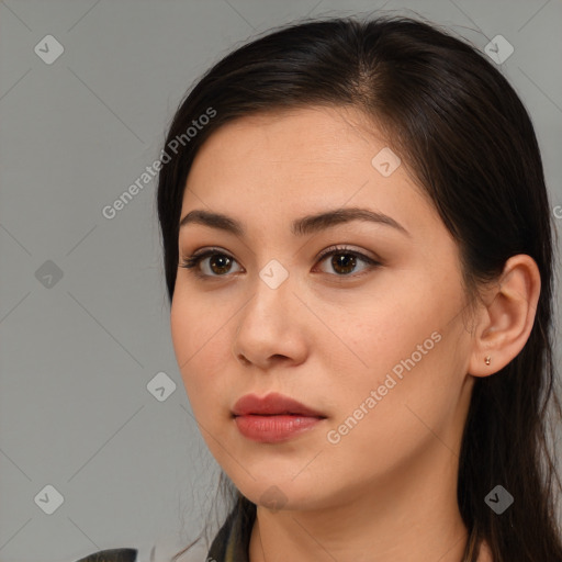 Neutral white young-adult female with long  brown hair and brown eyes