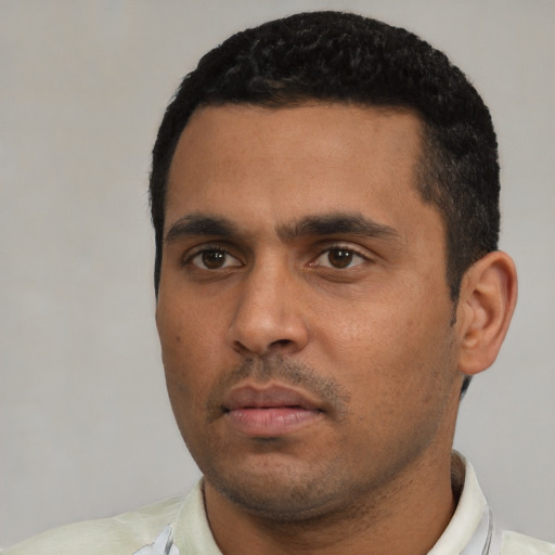 Neutral latino young-adult male with short  black hair and brown eyes