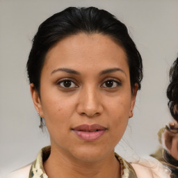 Joyful asian young-adult female with medium  brown hair and brown eyes