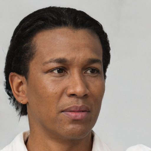 Neutral latino adult male with short  black hair and brown eyes