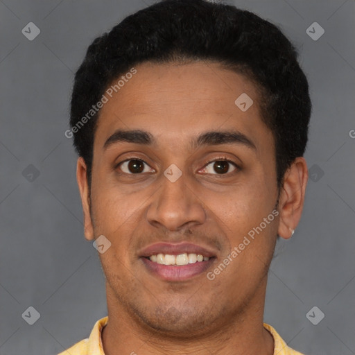 Joyful latino young-adult male with short  black hair and brown eyes