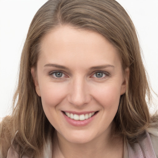 Joyful white young-adult female with long  brown hair and grey eyes