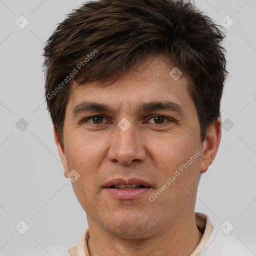 Joyful white adult male with short  brown hair and brown eyes