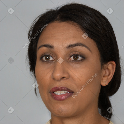 Joyful asian adult female with medium  brown hair and brown eyes