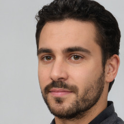 Neutral white young-adult male with short  black hair and brown eyes
