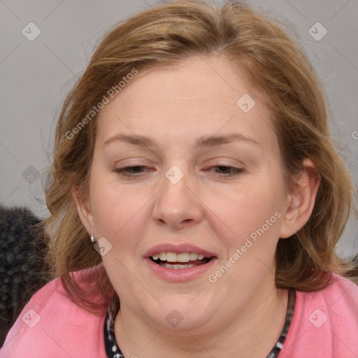 Joyful white adult female with medium  brown hair and blue eyes