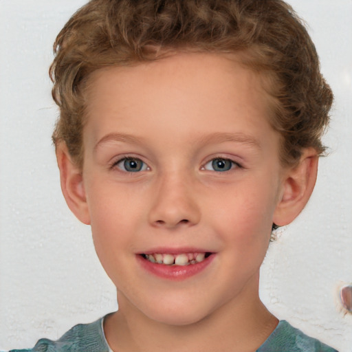 Joyful white child female with short  brown hair and blue eyes