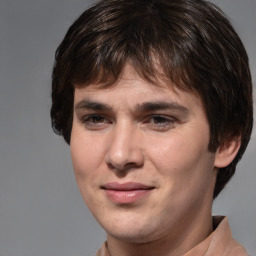 Joyful white young-adult male with medium  brown hair and brown eyes