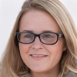 Joyful white young-adult female with long  brown hair and blue eyes