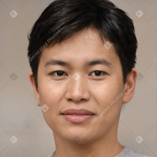 Joyful asian young-adult male with short  brown hair and brown eyes