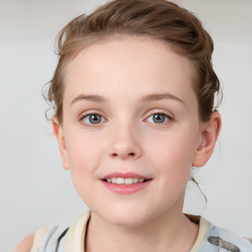 Joyful white child female with medium  brown hair and blue eyes