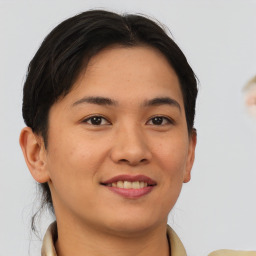 Joyful asian young-adult female with short  brown hair and brown eyes