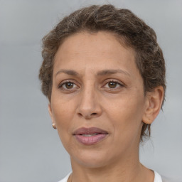 Joyful white adult female with short  brown hair and brown eyes