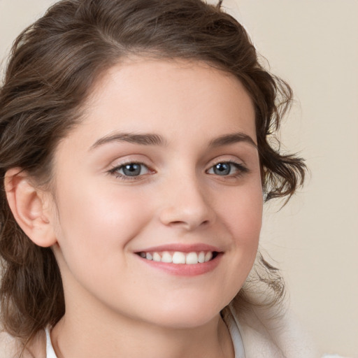 Joyful white child female with medium  brown hair and brown eyes