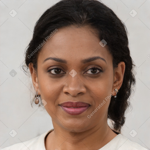 Joyful black adult female with medium  brown hair and brown eyes