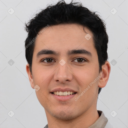 Joyful white young-adult male with short  black hair and brown eyes