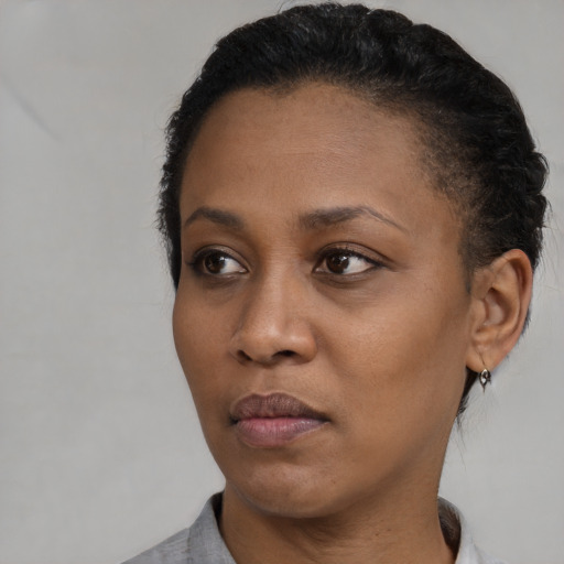 Neutral black young-adult female with short  black hair and brown eyes