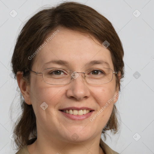 Joyful white adult female with medium  brown hair and grey eyes