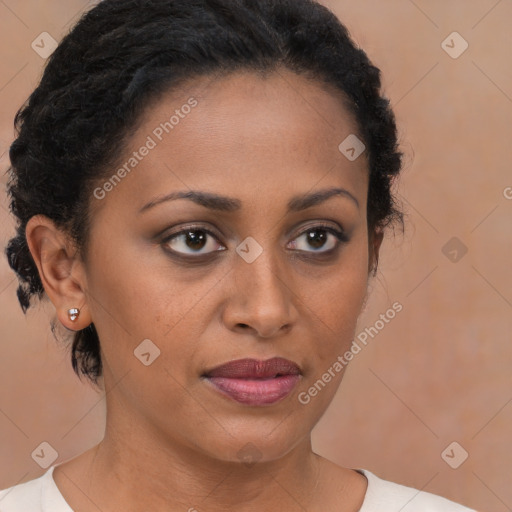 Joyful black young-adult female with medium  brown hair and brown eyes