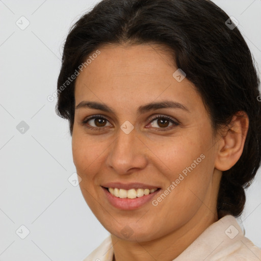 Joyful white adult female with medium  brown hair and brown eyes