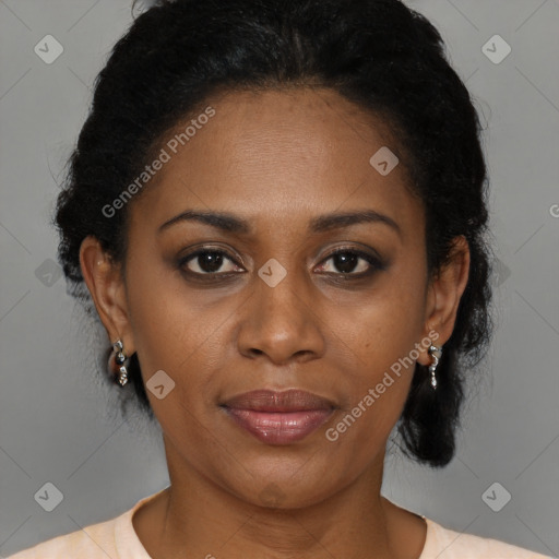 Joyful black adult female with medium  brown hair and brown eyes