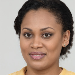Joyful black young-adult female with medium  brown hair and brown eyes
