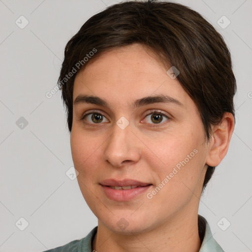 Joyful white young-adult female with short  brown hair and brown eyes